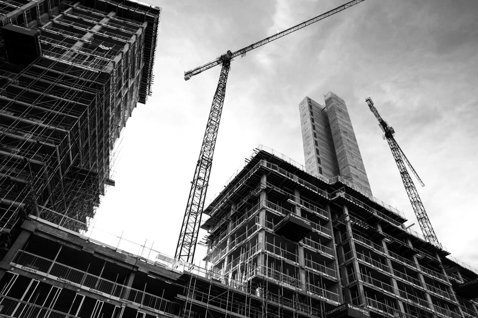 Construction site with engineers and heavy equipment — illustrative